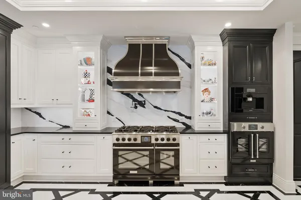a kitchen with a sink appliances and cabinets