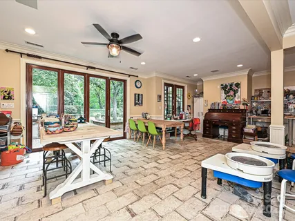 a living room with furniture a fireplace and a table