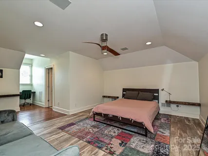 a bathroom with a shower and a sink