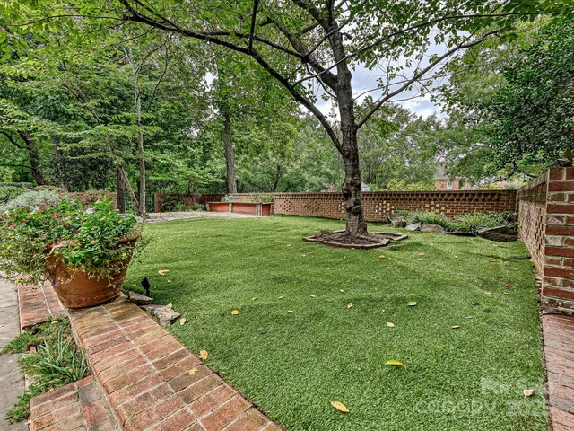 a view of a patio with a table chairs and a patio