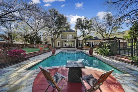 a view of a patio with chair and tables