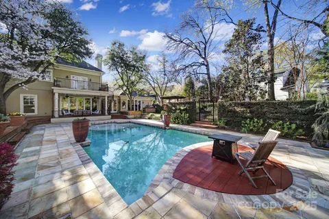 a view of backyard with seating space