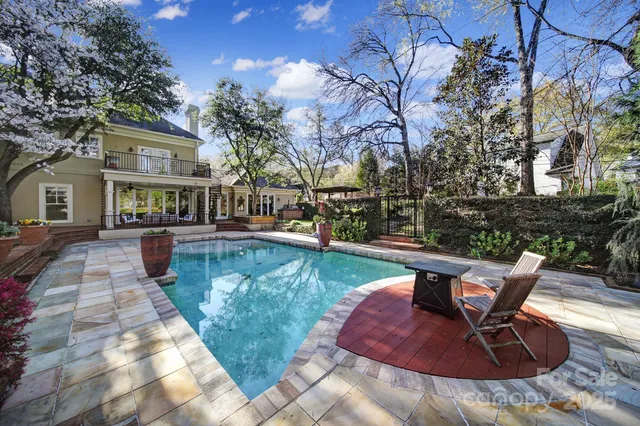 a view of backyard with seating space