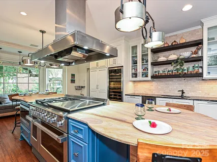 a kitchen with a table and chairs in it