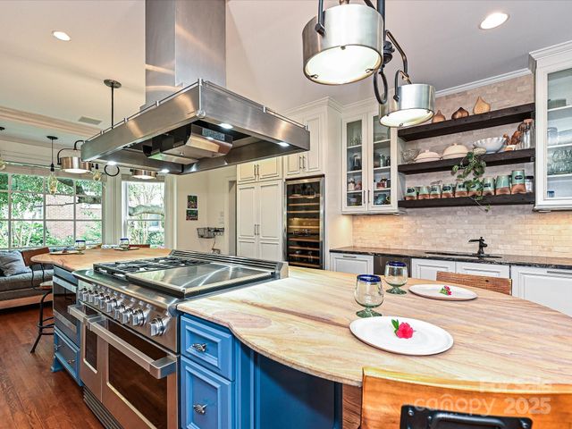 a kitchen with a table and chairs in it