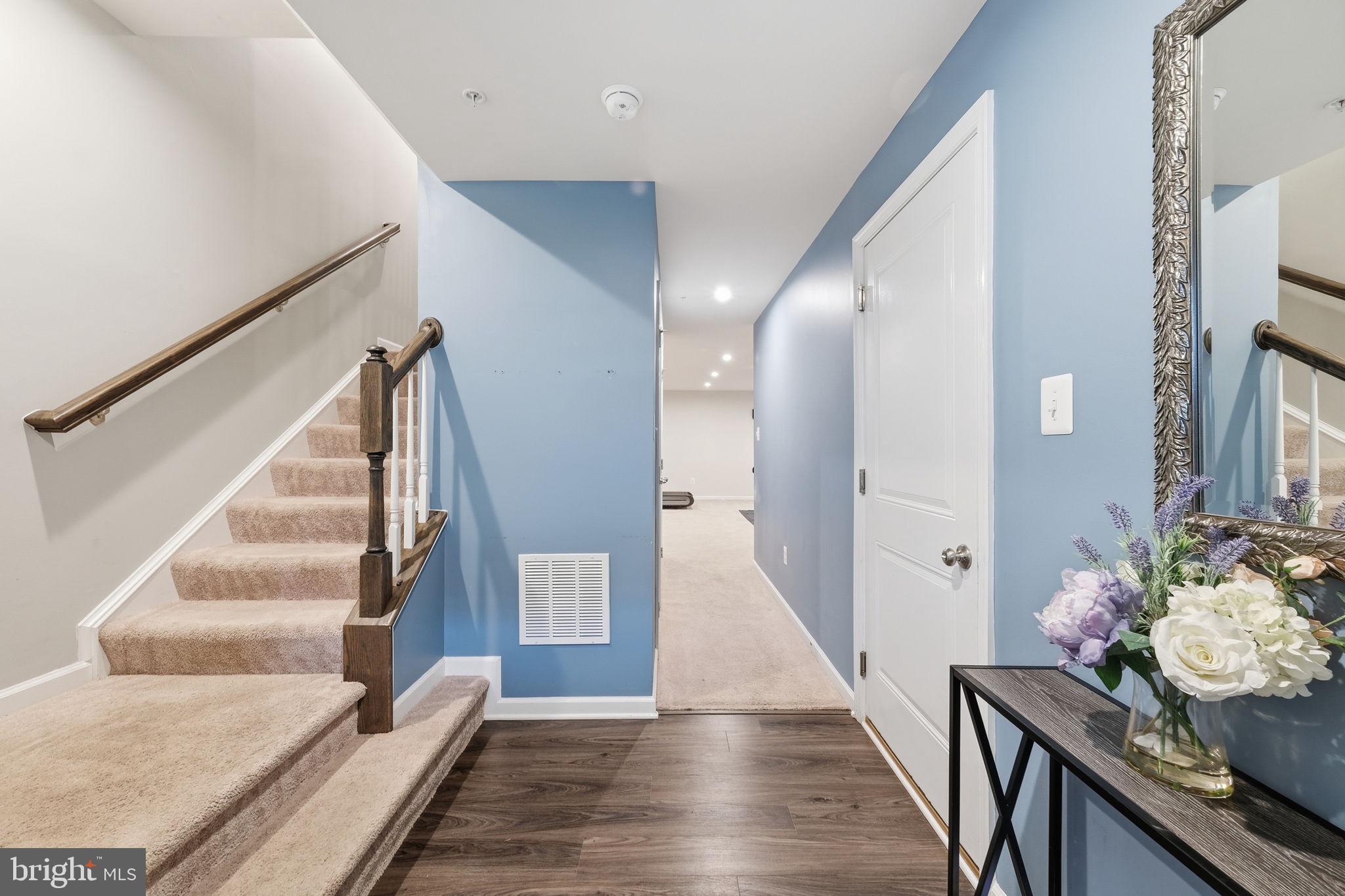 3012 Bretons Ridge Way Hanover, MD 21076 - Photo 4 of 37 a view of entryway and hall with wooden floor