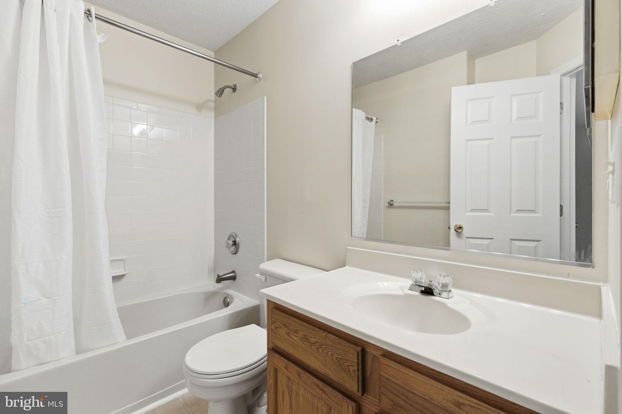 2801 Profitt Path Edgewood, MD 21040 - Photo 17 of 32 a bathroom with a sink toilet and shower