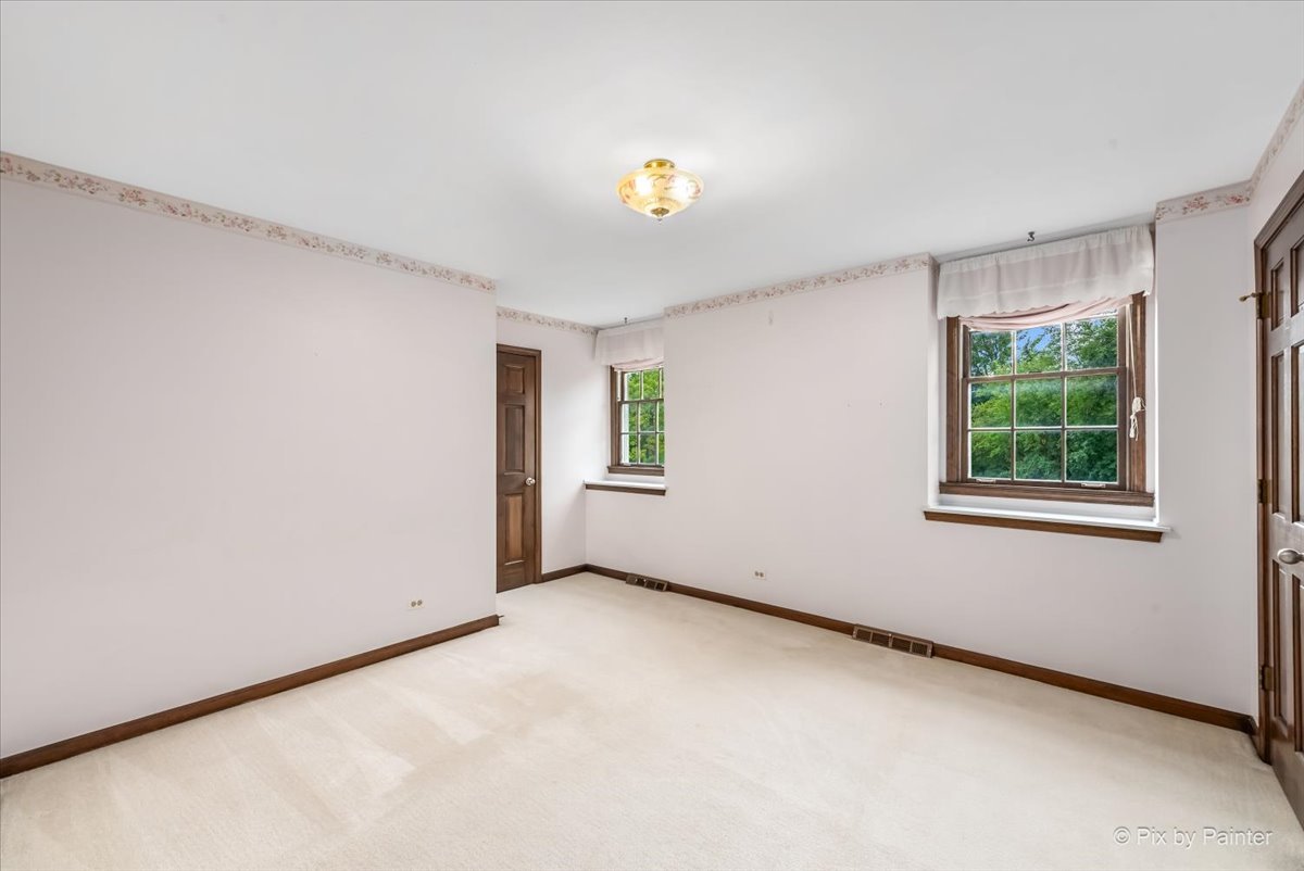 27W650 Mack Road Wheaton, IL 60189 - Photo 19 of 28 a view of an empty room with a window
