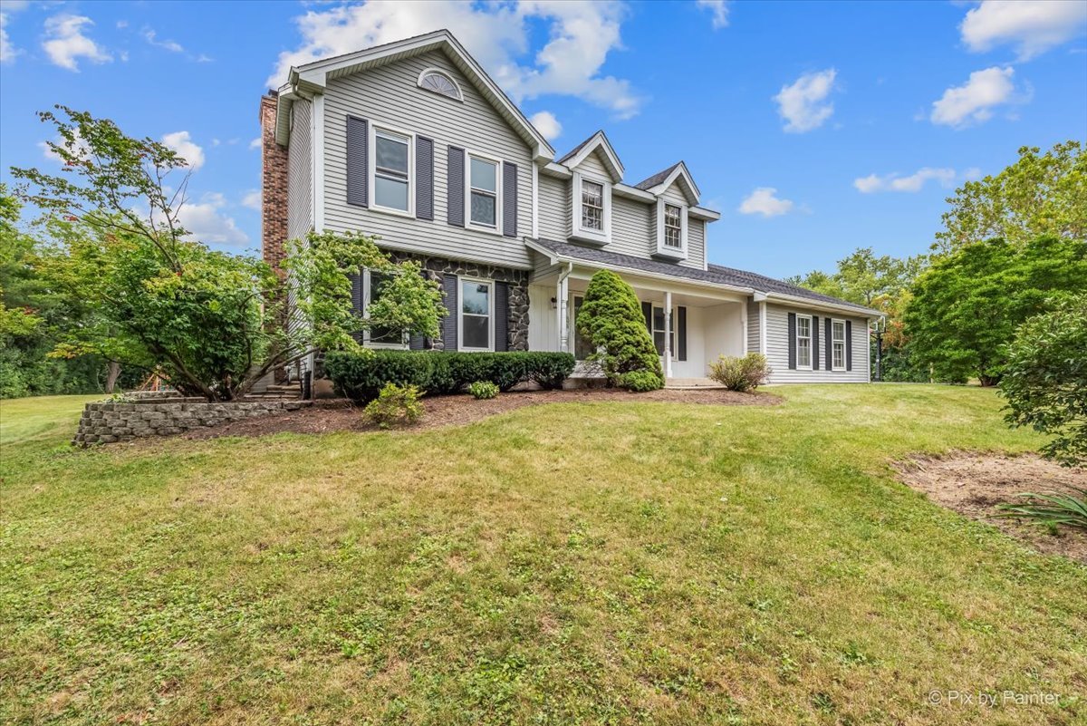 27W650 Mack Road Wheaton, IL 60189 - Photo 2 of 28 a front view of a house with garden