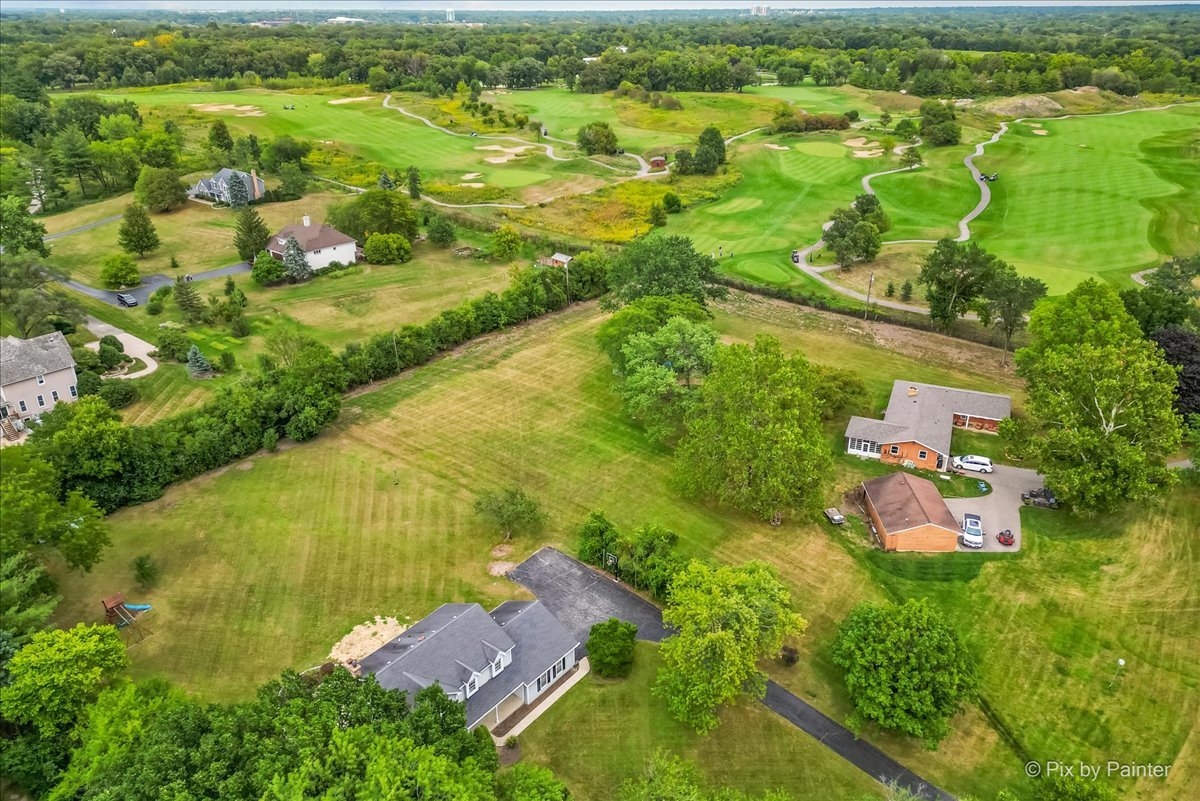 27W650 Mack Road Wheaton, IL 60189 - Photo 27 of 28 an aerial view of residential houses with outdoor space and trees