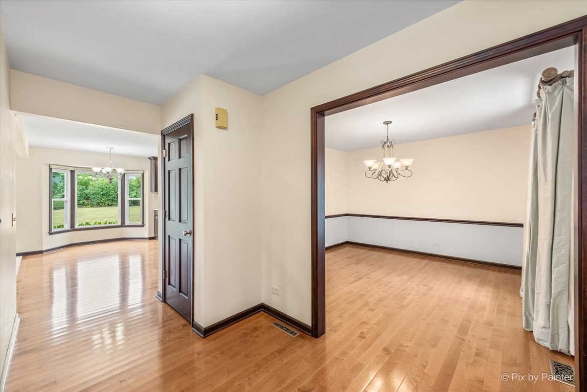 27W650 Mack Road Wheaton, IL 60189 - Photo 4 of 28 a view of a room with wooden floor and a window
