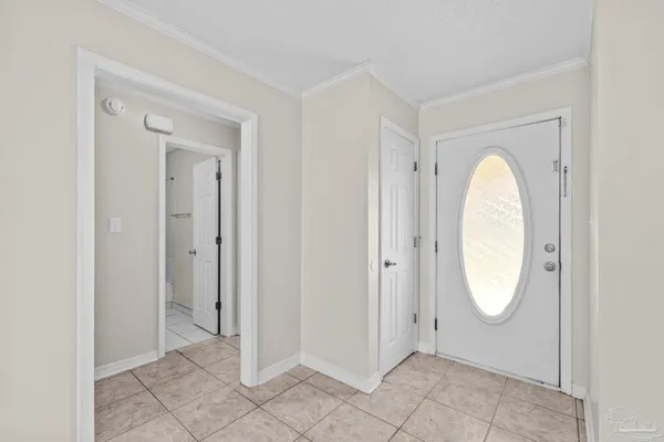 a view of an entryway with wooden floor and mirror