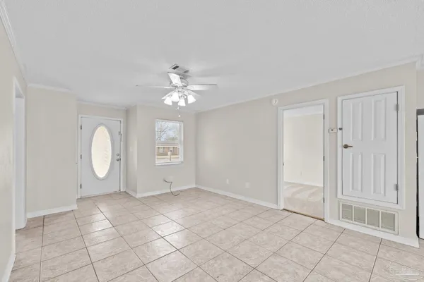 a view of an empty room with a window