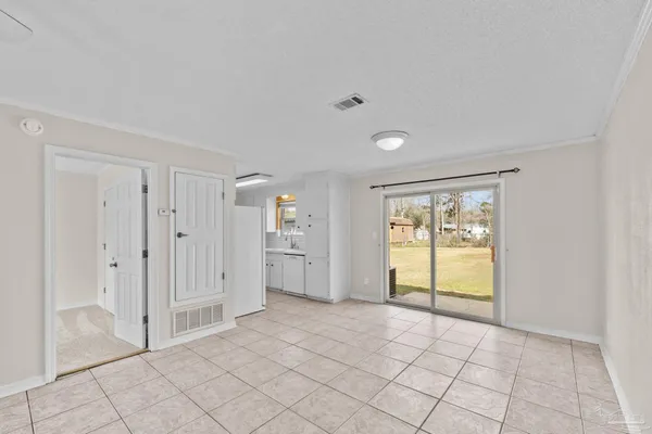 a view of an empty room and window