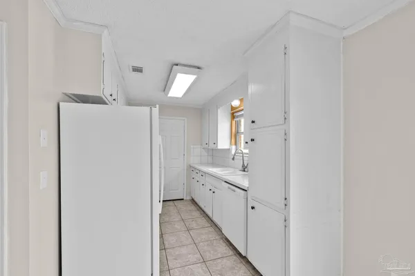 a bathroom with a double vanity sink and mirror