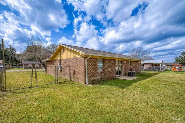 a view of a backyard with swimming pool