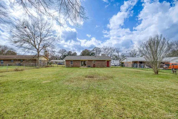 a view of a large garden with large trees