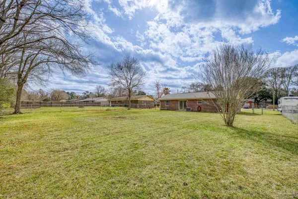 a view of outdoor space with deck and trees