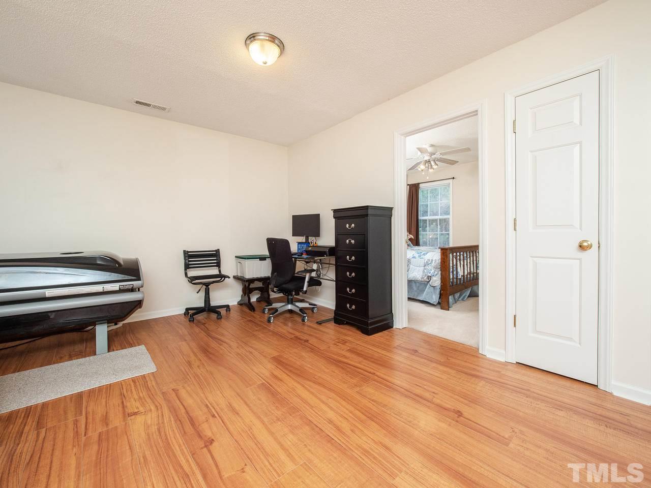5000 Tommans Trail Raleigh, NC 27616 - Photo 14 of 30 a room with furniture a desk and chair