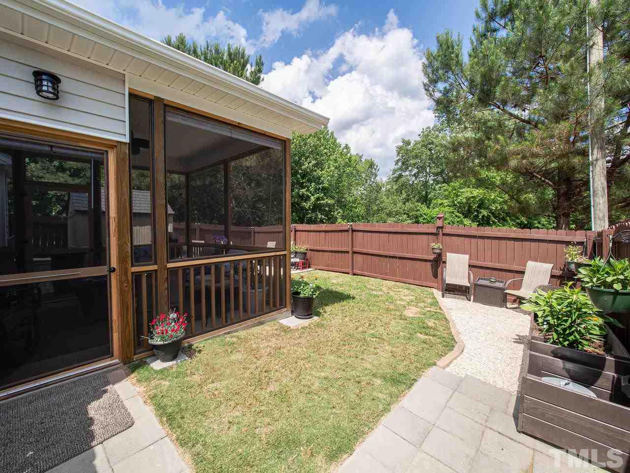 5000 Tommans Trail Raleigh, NC 27616 - Photo 23 of 30 a view of a backyard with sitting area