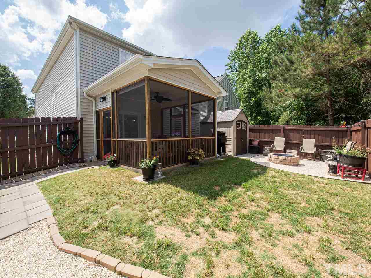 5000 Tommans Trail Raleigh, NC 27616 - Photo 24 of 30 a view of a house with backyard porch and sitting area