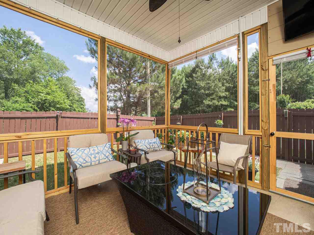 5000 Tommans Trail Raleigh, NC 27616 - Photo 30 of 30 a outdoor living room with furniture and a large window
