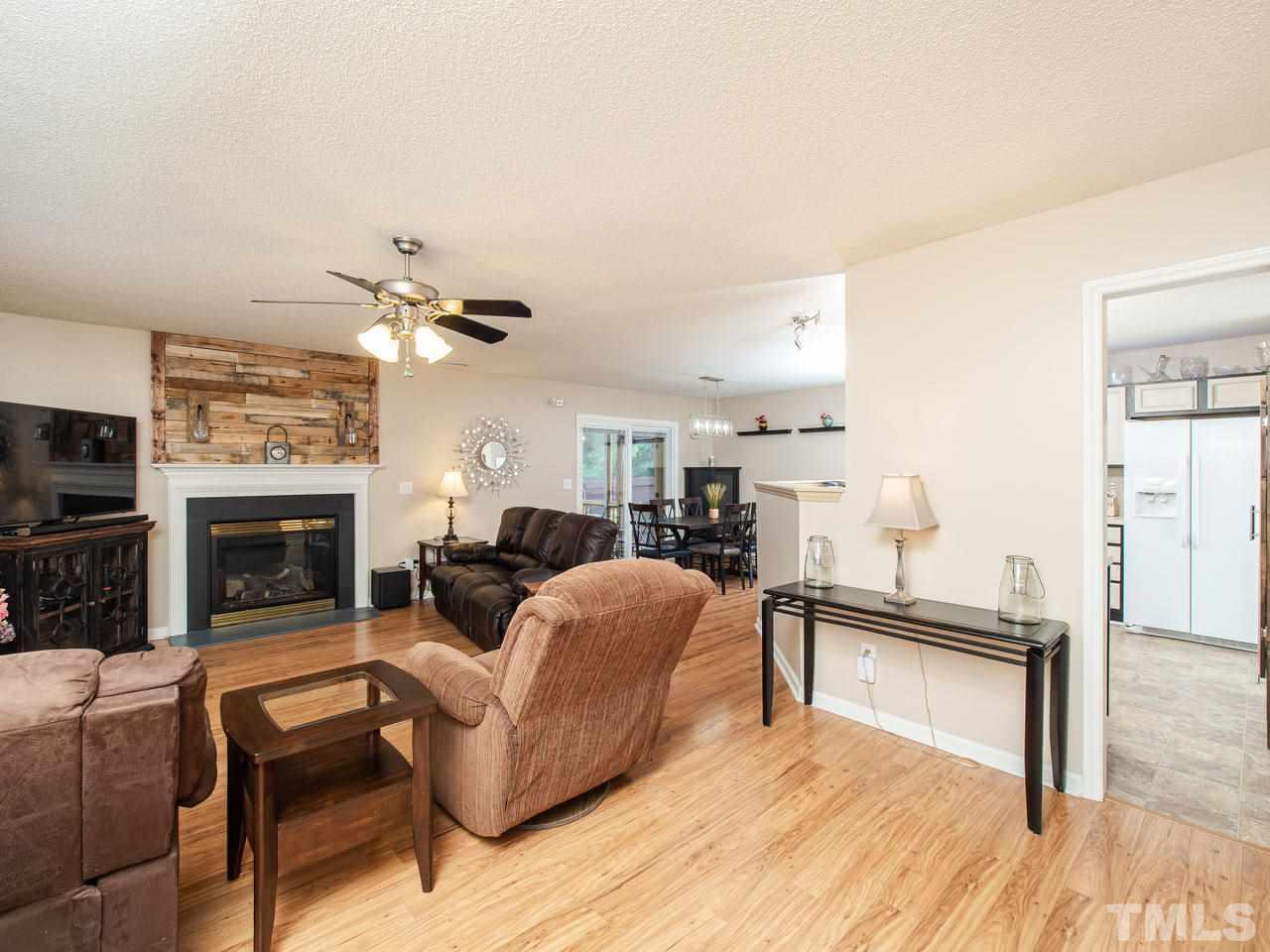 5000 Tommans Trail Raleigh, NC 27616 - Photo 5 of 30 a living room with furniture and a fireplace