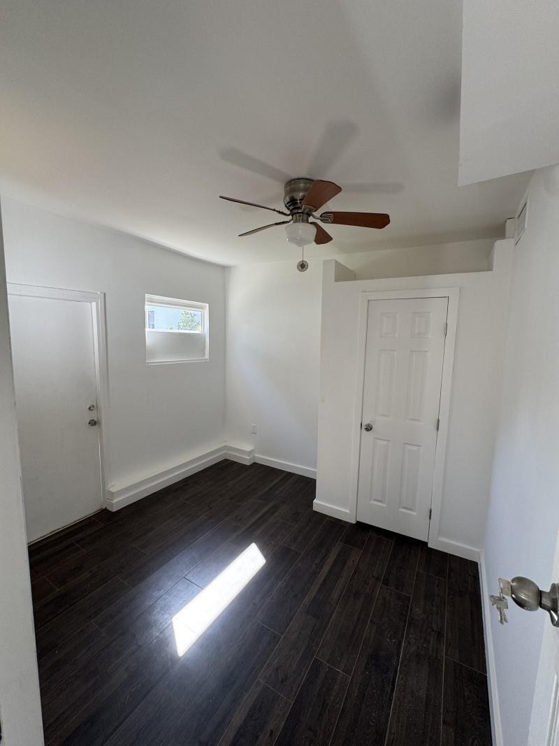 261 Northwest 81st Street, Unit B Miami, FL 33150 - Photo 12 of 12 a view of an empty room with wooden floor