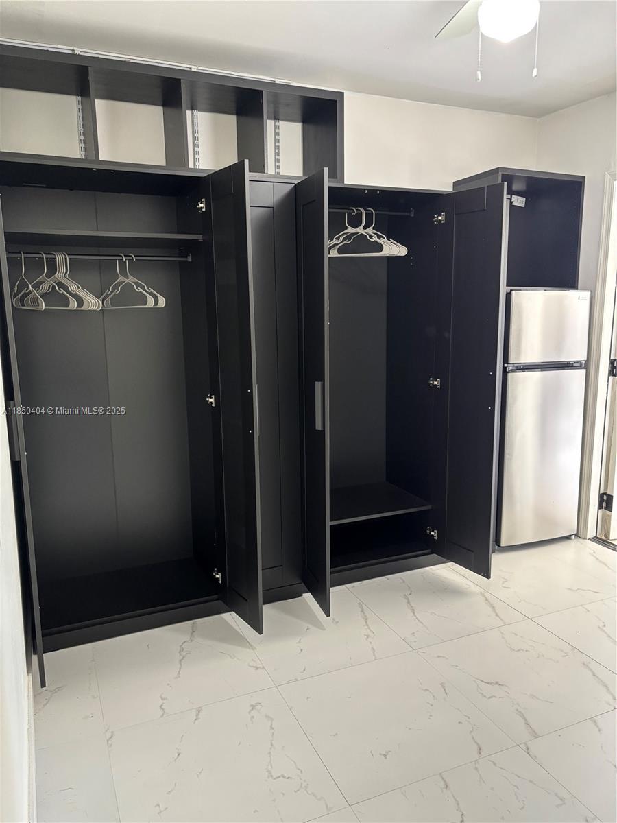 15401 Southwest 144th Avenue, Unit A Miami, FL 33177 - Photo 3 of 6 a view of an empty room