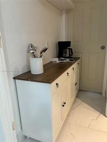 a kitchen with sink and cabinets