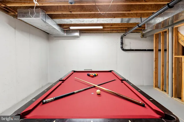 a room with table and a chandelier