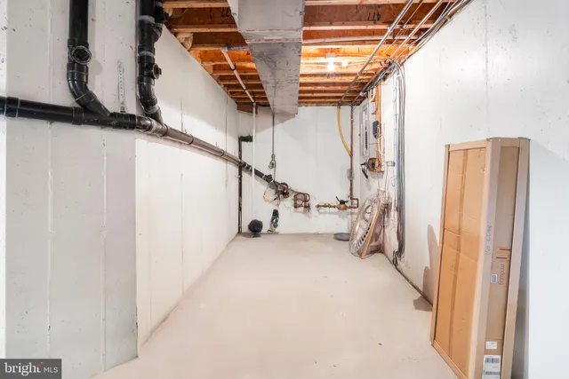 a view of hallway with stairs and wooden floor