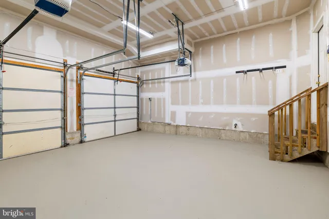 a view of an empty room with stairs