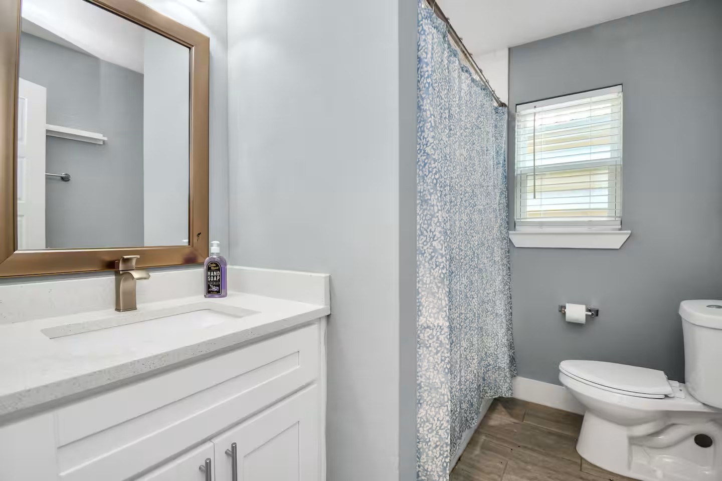 3318 Wichita Street Houston, TX 77004 - Photo 12 of 36 a bathroom with a granite countertop sink toilet and shower