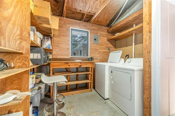 a utility room with dryer and washer