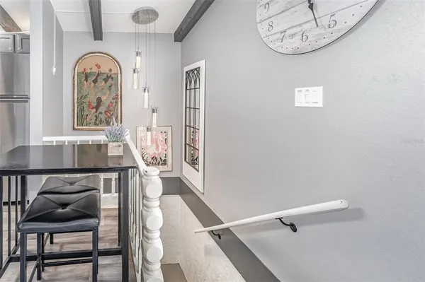 a view of a hallway with seating area