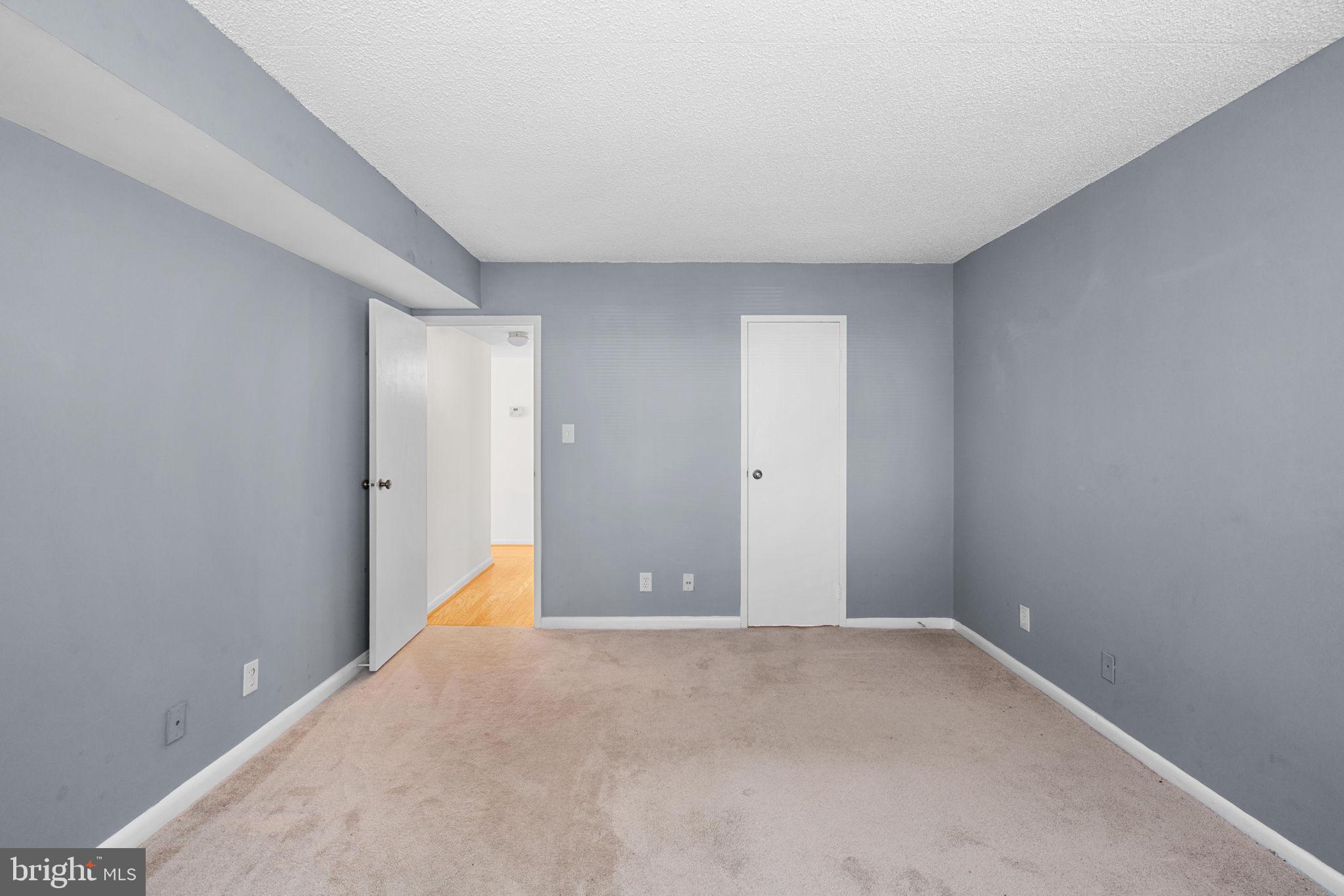 11807 Breton Court, Unit 1A Reston, VA 20191 - Photo 13 of 19 From the bedroom to the closet and hall