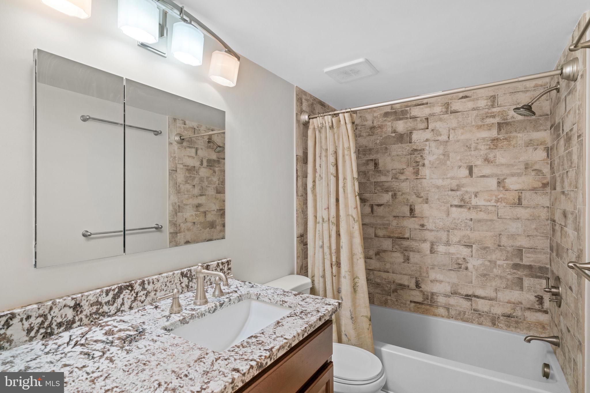 11807 Breton Court, Unit 1A Reston, VA 20191 - Photo 14 of 19 Elegant renovated bath with plenty of light