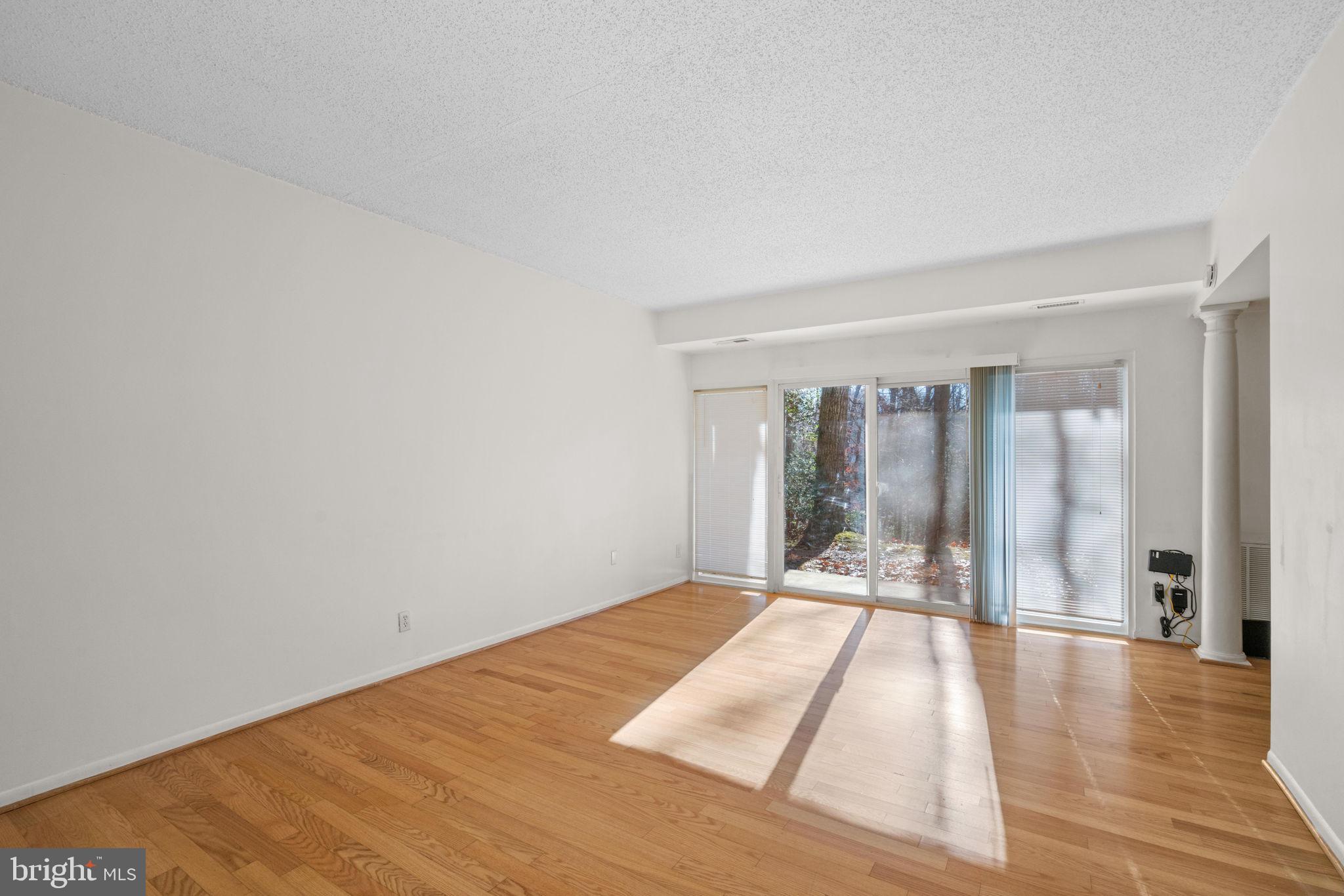 11807 Breton Court, Unit 1A Reston, VA 20191 - Photo 4 of 19 with a wooded view