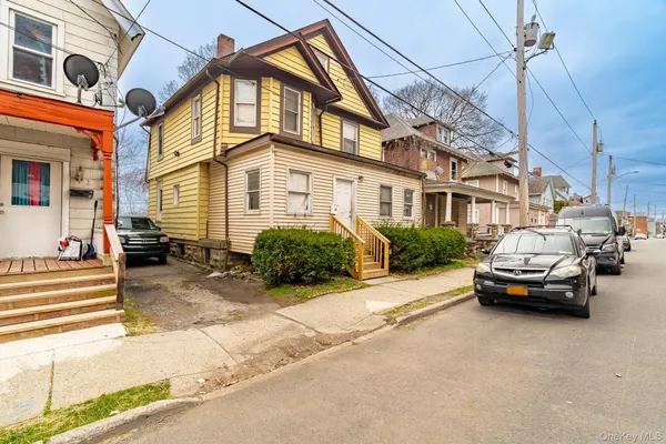 a car parked in front of a house