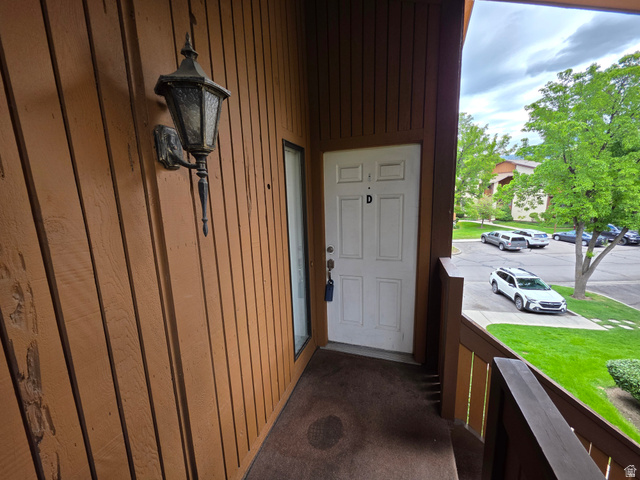 6852 Countrywoods Circle, Unit 5D Midvale, UT 84047 - Photo 5 of 50 Entry. Guest parking to right in front of building.