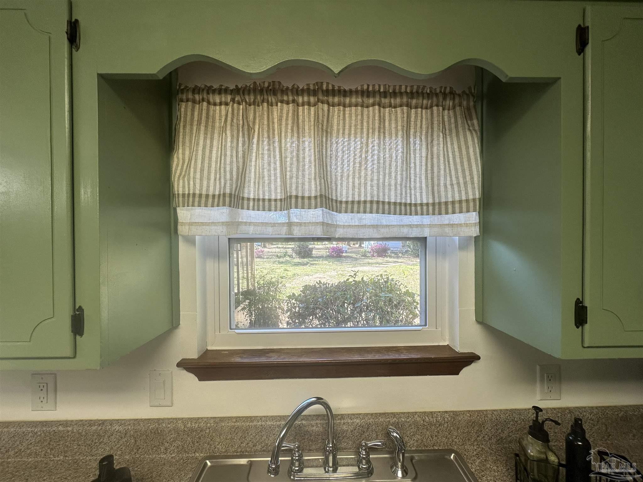 5057 Babb Lane Pace, FL 32571 - Photo 16 of 33 a view of a window of a house