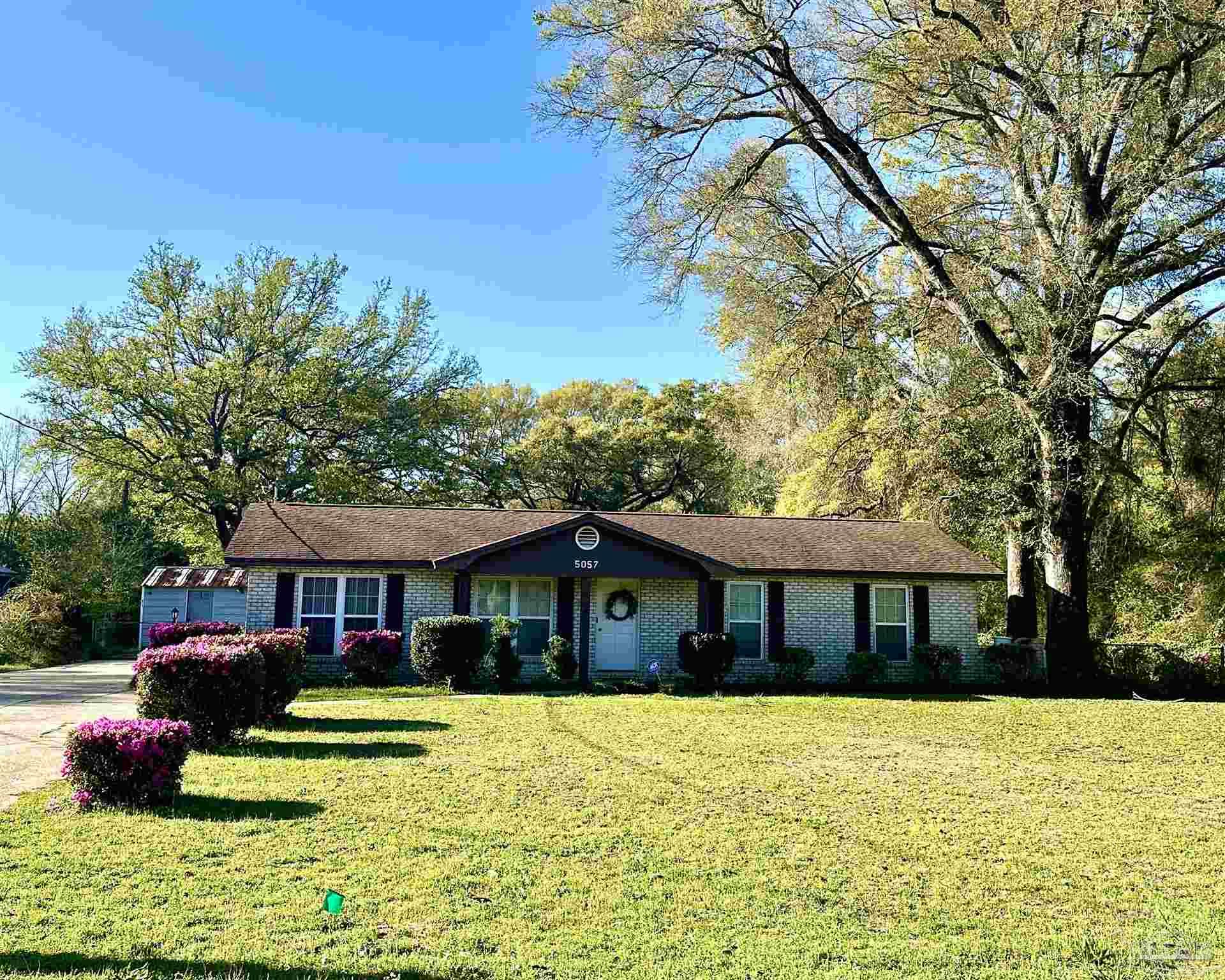 5057 Babb Lane Pace, FL 32571 - Photo 2 of 33 a front view of a house with a yard