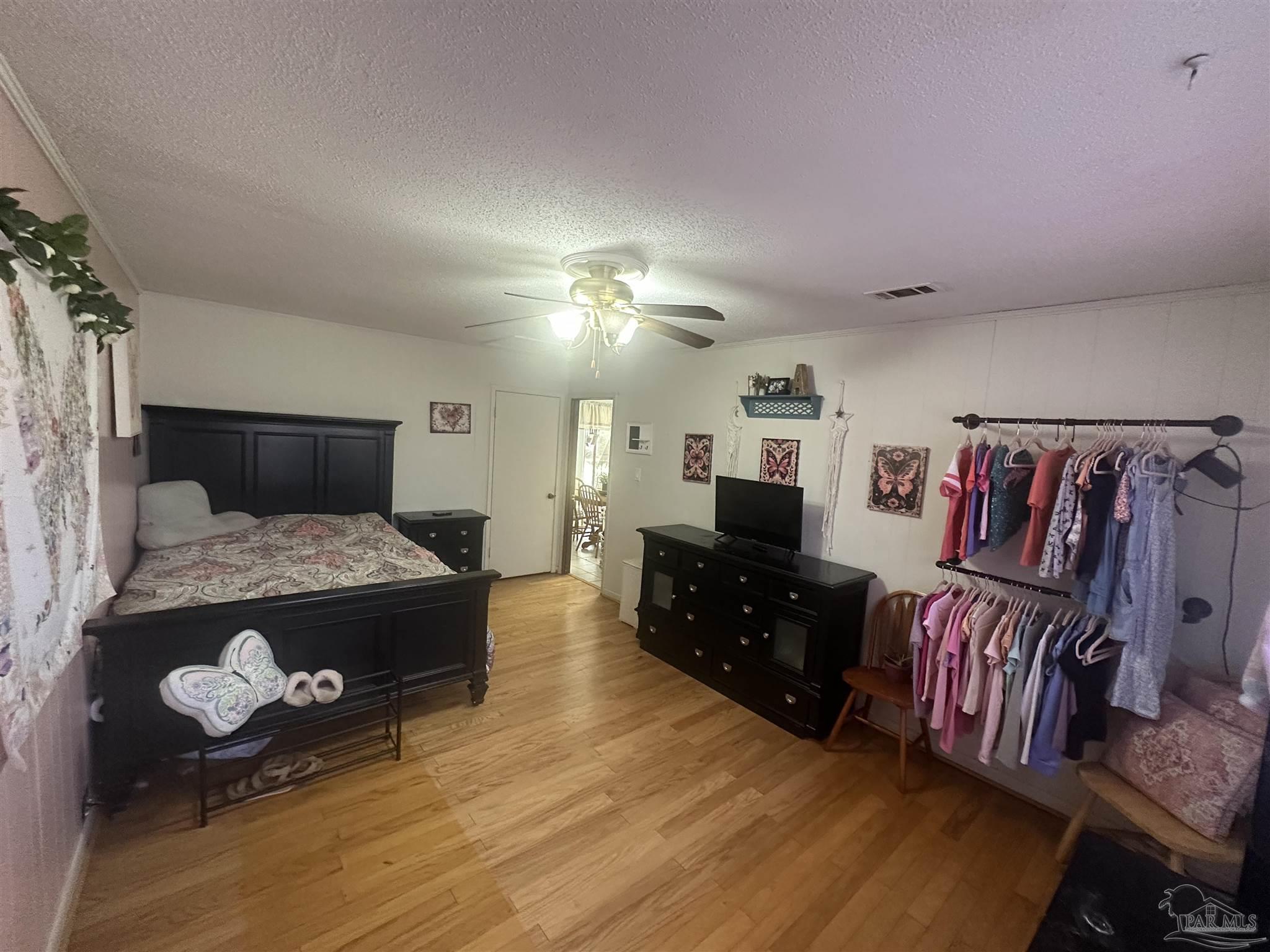 5057 Babb Lane Pace, FL 32571 - Photo 27 of 33 a living room with furniture and a flat screen tv