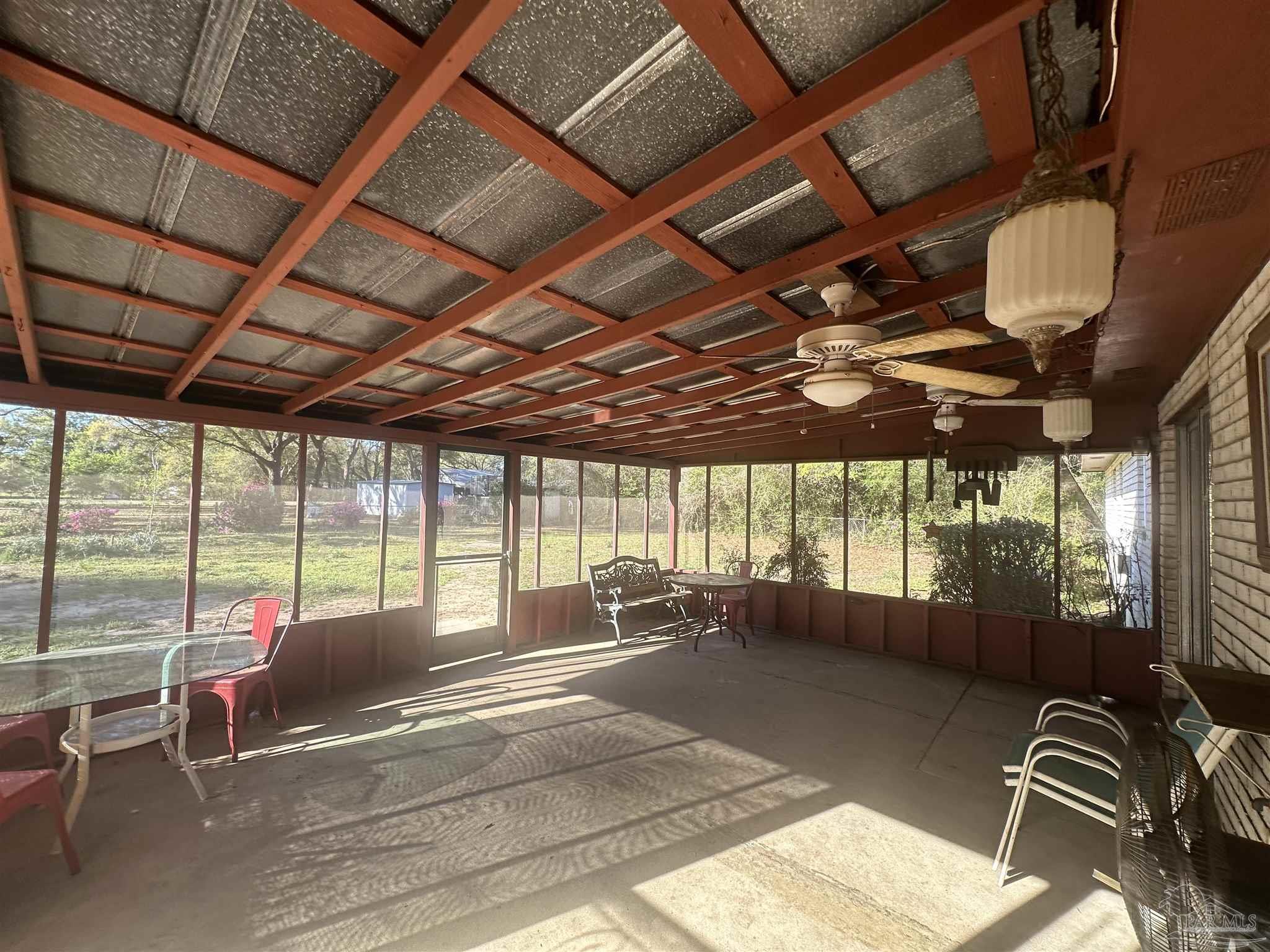 5057 Babb Lane Pace, FL 32571 - Photo 29 of 33 a living room with furniture a large window with outer view