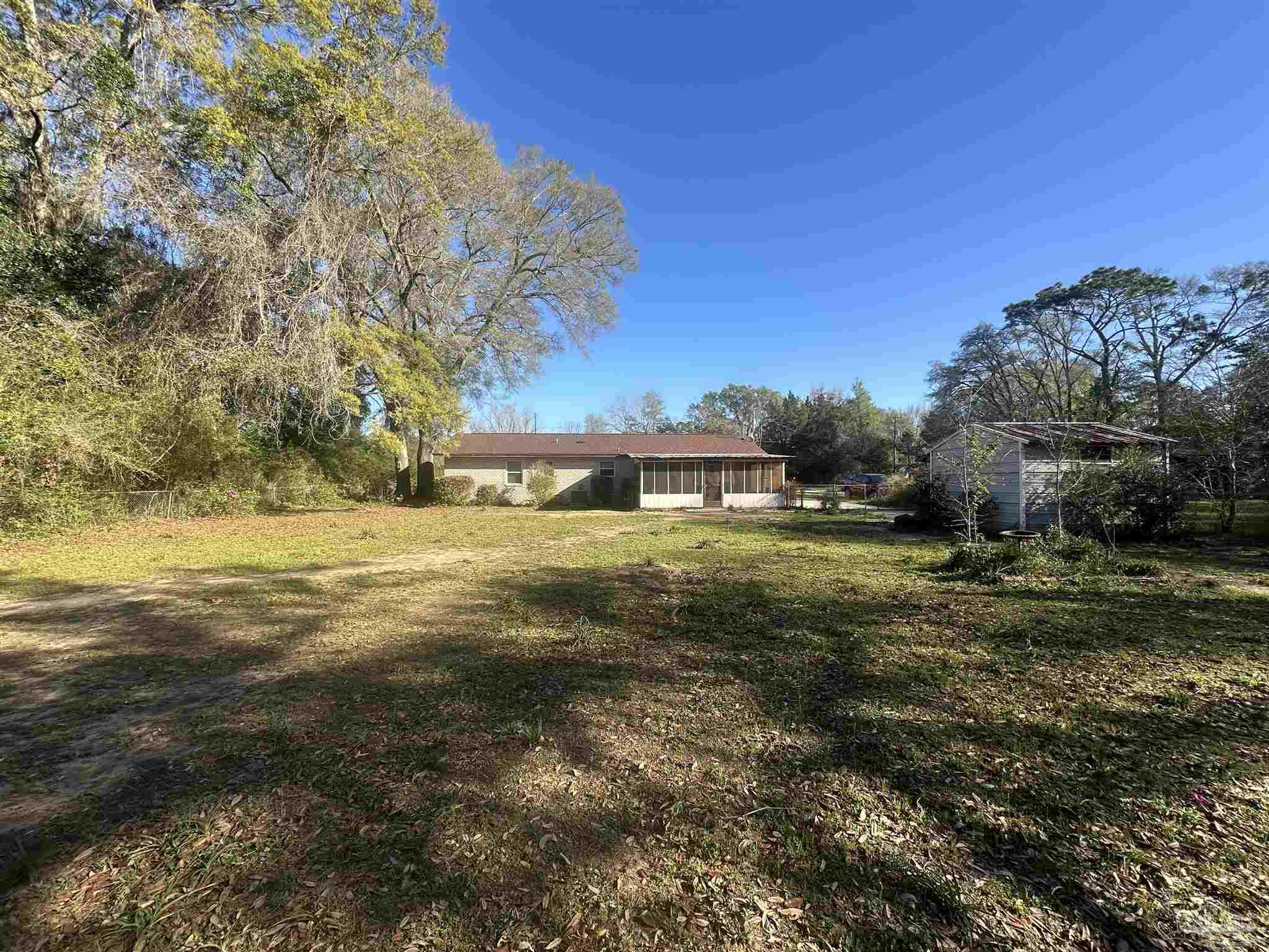 5057 Babb Lane Pace, FL 32571 - Photo 30 of 33 a view of green field with tree in the background