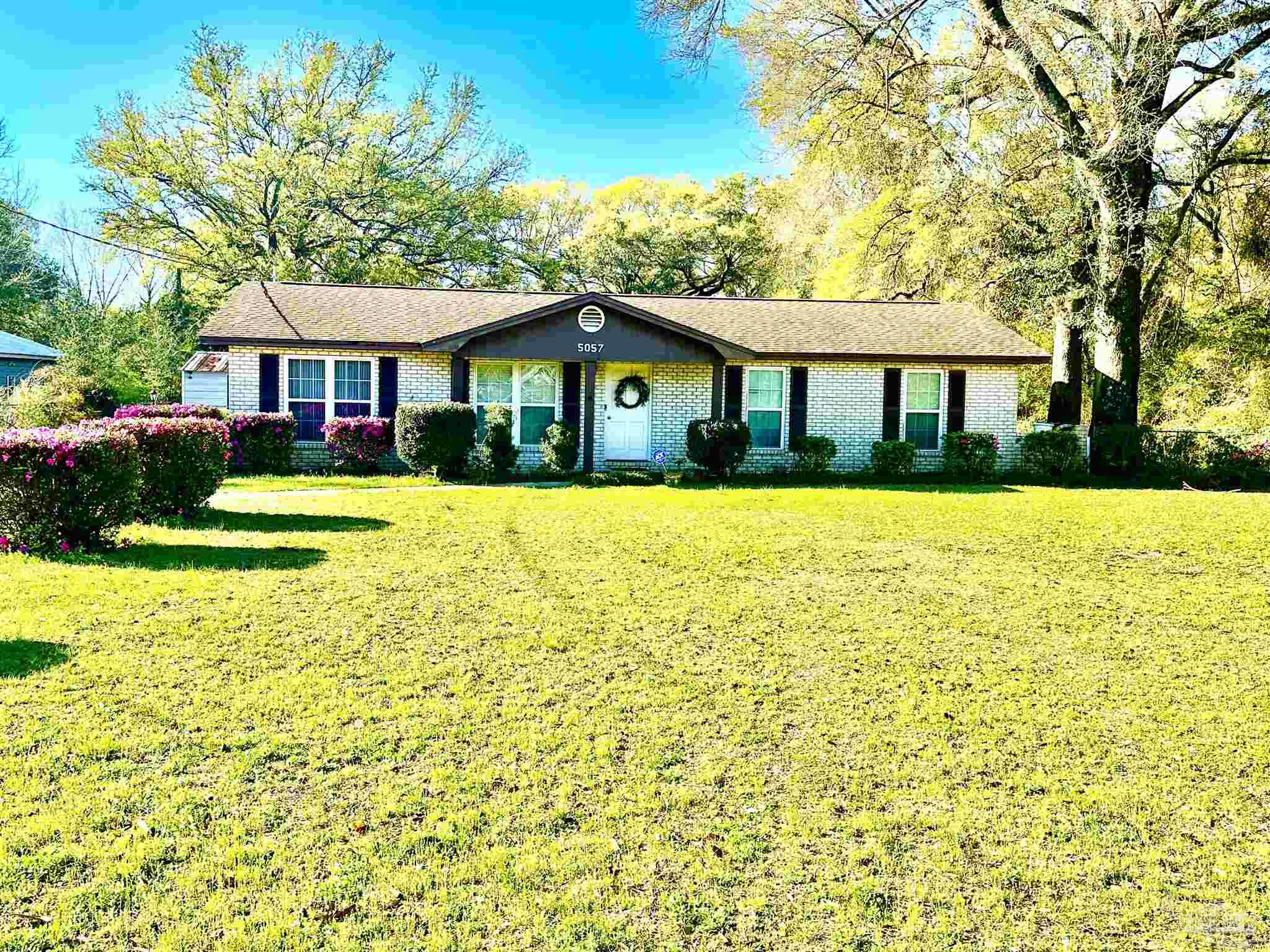 5057 Babb Lane Pace, FL 32571 - Photo 3 of 33 a front view of a house with swimming pool