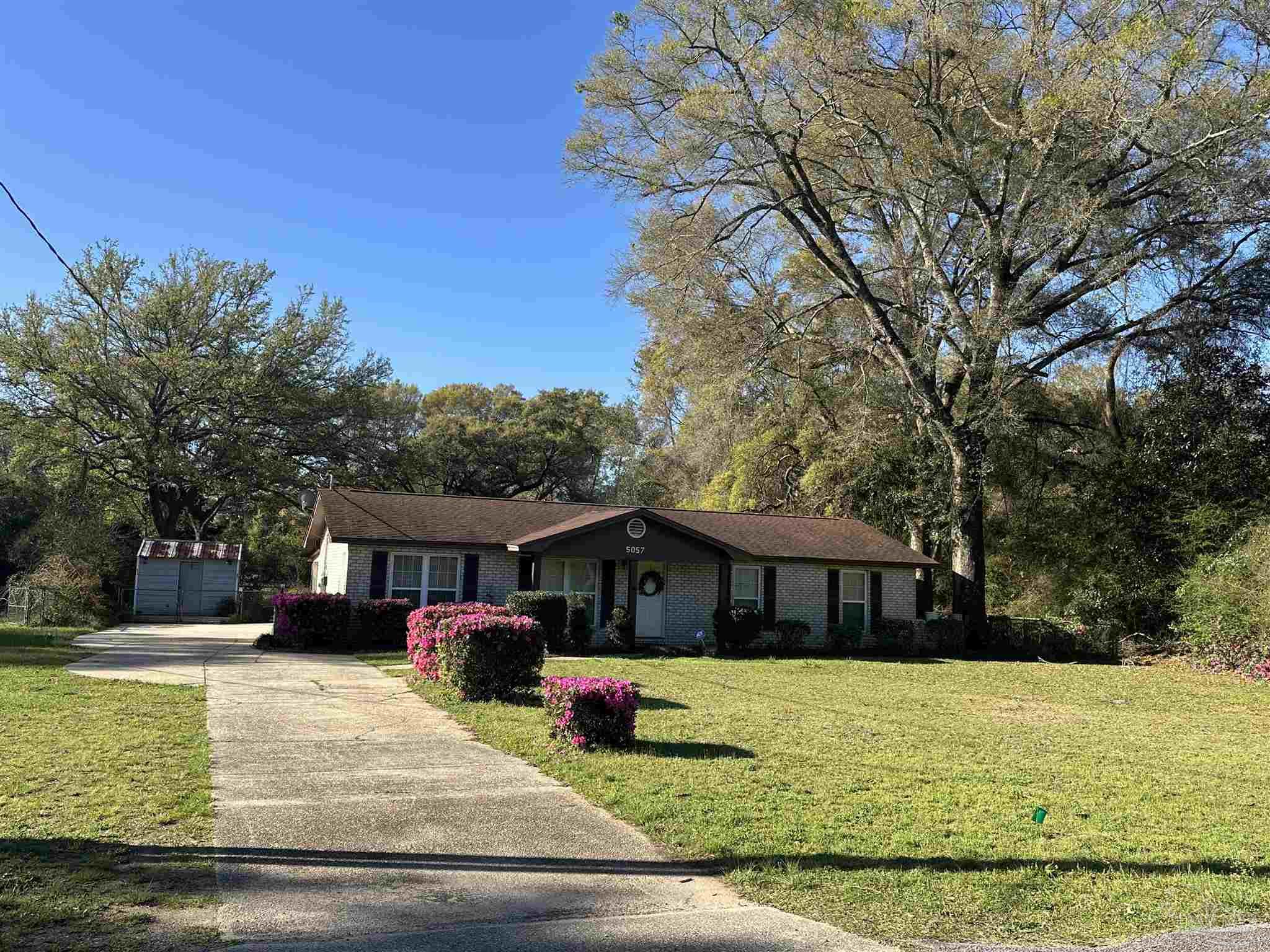 5057 Babb Lane Pace, FL 32571 - Photo 5 of 33 a front view of a house with a yard