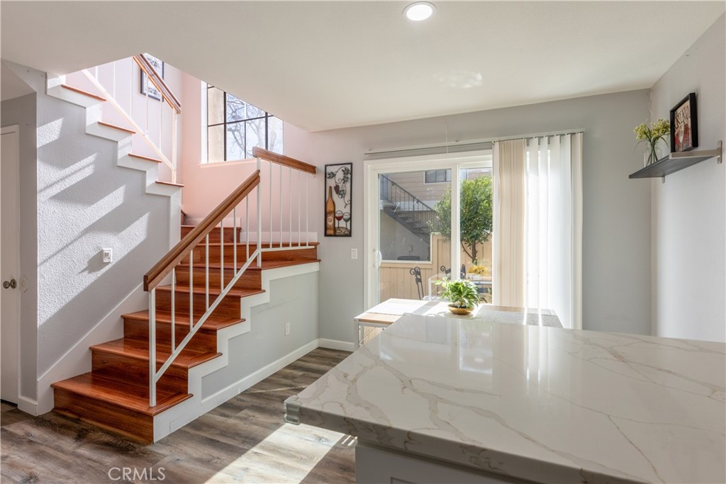 12635 Briarglen Loop, Unit H Stanton, CA 90680 - Photo 14 of 43 a view of entryway and hall with wooden floor