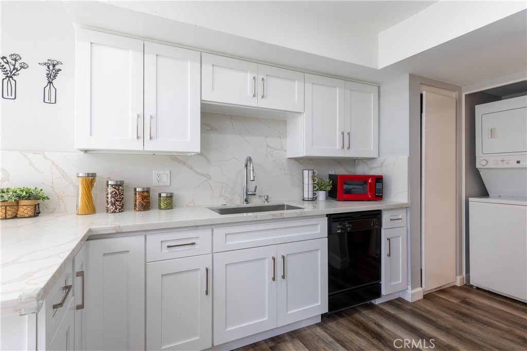 12635 Briarglen Loop, Unit H Stanton, CA 90680 - Photo 15 of 43 a kitchen with white cabinets and sink